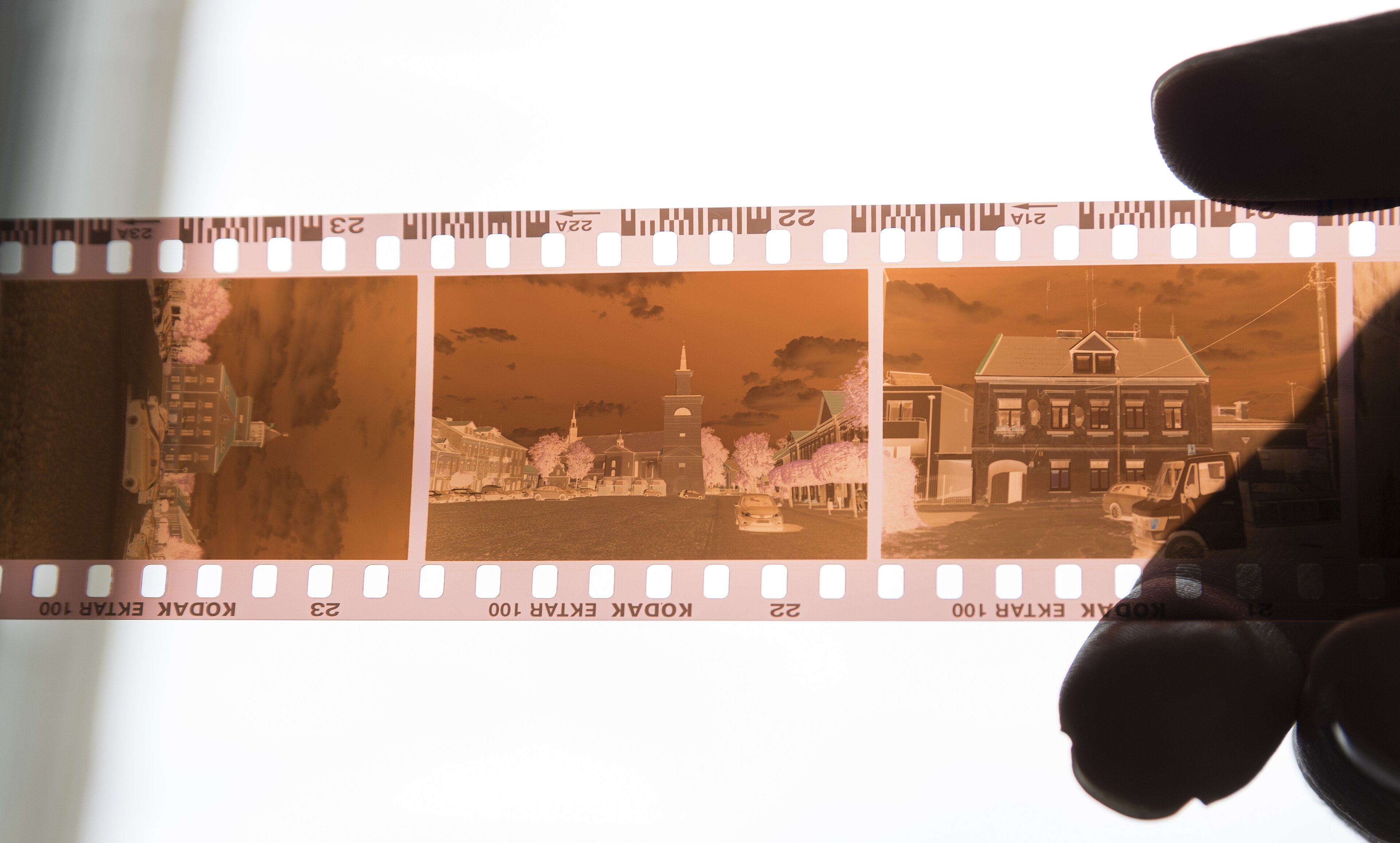 Original colour film negative showing a town square
